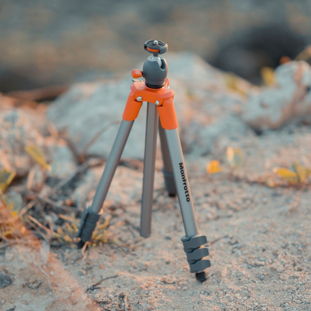 silver and red Monfrotto tripod